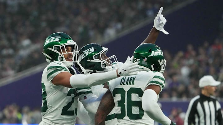 Oct 6, 2024; London, United Kingdom; New York Jets safety Tony Adams (22), cornerback Isaiah Oliver (23) and safety Chuck Clark (36) celebrate against the Minnesota Vikings in the second half at Tottenham Hotspur Stadium. Oct 6, 2024; London, United Kingdom; New York Jets safety Tony Adams (22), cornerback Isaiah Oliver (23) and safety Chuck Clark (36) celebrate against the Minnesota Vikings in the second half at Tottenham Hotspur Stadium.