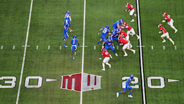 A general overall view as Boise State Broncos quarterback Taylen Green (10) prepares to take the snap against the UNLV Rebels on the Mountain West conference logo in the first half during the Mountain West Championship at Allegiant Stadium. Mandatory Credit: Kirby Lee-Imagn Images