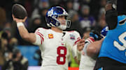 Nov 10, 2024; Munich, Germany; New York Giants quarterback Daniel Jones (8) throws the ball against the Carolina Panthers  in the second half during the 2024 NFL Munich Game at Allianz Arena. Mandatory Credit: Kirby Lee-Imagn Images