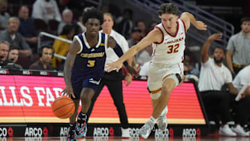 Nov 4, 2024; Los Angeles, California, USA; Chattanooga Mocs guard Honor Huff (3) dribbles the ball against Southern California Trojans guard Clark Slajchert (32) in the second half at Galen Center. Mandatory Credit: Kirby Lee-Imagn Images