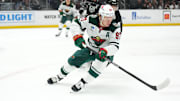 Apr 15, 2024; Los Angeles, California, USA; Minnesota Wild left wing Kirill Kaprizov (97) pursues the puck against LA Kings defenseman Mikey Anderson (44) in the first period at Crypto.com Arena. Mandatory Credit: Kirby Lee-Imagn Images
