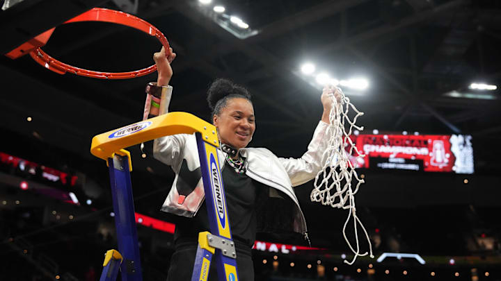 Apr 7, 2024; Cleveland, OH, USA; South Carolina Gamecocks head coach Dawn Staley cuts down the net after the 2024 NCAA Tournament Women's Final Four championship game against the Iowa Hawkeyes at Rocket Mortgage FieldHouse.  Mandatory Credit: Kirby Lee-Imagn Images