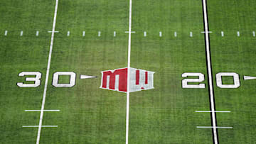 The Mountain West conference logo on the field at Allegiant Stadium. Mandatory Credit: Kirby Lee-Imagn Images