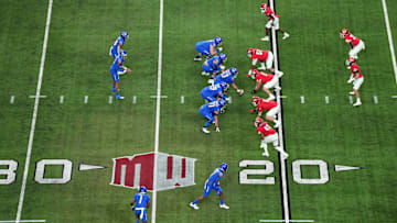 A general overall view as Boise State Broncos quarterback Taylen Green (10) prepares to take the snap against the UNLV Rebels on the Mountain West conference logo in the first half during the Mountain West Championship at Allegiant Stadium. Mandatory Credit: Kirby Lee-Imagn Images