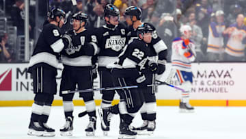 Apr 21, 2025; Los Angeles, California, USA; LA Kings left wing Kevin Fiala (22) celebrates with teammates after scoring a goal in the third period of game one of the first round of the 2025 Stanley Cup Playoffs against the Edmonton Oilers at Crypto.com Arena. Mandatory Credit: Kirby Lee-Imagn Images