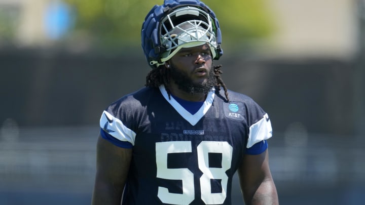 Jul 29, 2023; Oxnard, CA, USA; Dallas Cowboys defensive tackle Mazi Smith (58) wears a Guardian helmet cap during training camp at the River Ridge Fields.