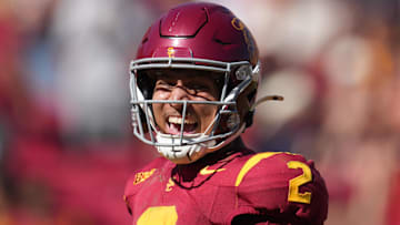 Sep 28, 2024; Los Angeles, California, USA; Southern California Trojans wide receiver Duce Robinson (2) celebrates after scoring on an 8-yard touchdown reception against the Wisconsin Badgersin the second half at United Airlines Field at Los Angeles Memorial Coliseum. Mandatory Credit: Kirby Lee-Imagn Images