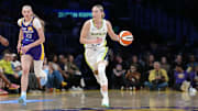 Aug 20, 2025; Los Angeles, California, USA; Dallas Wings guard Paige Bueckers (5) dribbles the ball against LA Sparks forward Cameron Brink (22) in the first half at Crypto.com Arena. Mandatory Credit: Kirby Lee-Imagn Images