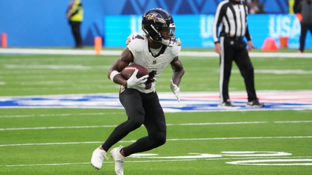 Baltimore Ravens receiver Zay Flowers runs with the ball against the Tennessee Titans