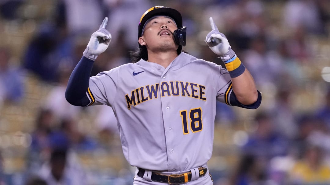 Aug 22, 2022; Los Angeles, California, USA; Milwaukee Brewers first baseman Keston Hiura (18) celebrates after hitting a home run in the ninth inning against the Los Angeles Dodgers at Dodger Stadium. Mandatory Credit: Kirby Lee-USA TODAY Sports