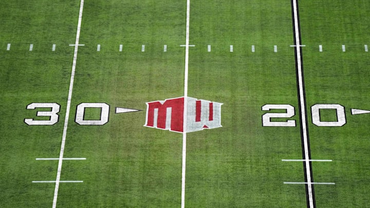 The Mountain West conference logo on the field at Allegiant Stadium. The Mountain West conference logo on the field at Allegiant Stadium.