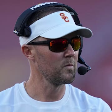 Oct 21, 2023; Los Angeles, California, USA; Southern California Trojans head coach Lincoln Riley watches from the sidelines against the Utah Utes in the first half at United Airlines Field at Los Angeles Memorial Coliseum. Mandatory Credit: Kirby Lee-Imagn Images