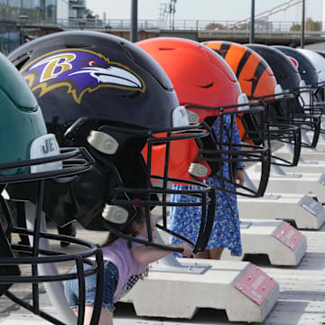 Oct 7, 2023; London, United Kingdom; Large oversized helmets of the New York Jets Baltimore Ravens, Cleveland Browns and Cincinnati Bengals at the NFL Experience London at the Battersea Power Station. Mandatory Credit: Kirby Lee-Imagn Images