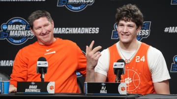 Mar 29, 2024; Los Angeles, CA, USA; Clemson Tigers coach Brad Brownell (left) and center PJ Hall.