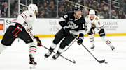 Nov 2, 2024; Los Angeles, California, USA; LA Kings left wing Tanner Jeannot (10) skates with the puck against the Chicago Blackhawks in the second period at Crypto.com Arena. Mandatory Credit: Kirby Lee-Imagn Images