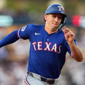 Jun 11, 2024; Los Angeles, California, USA; Texas Rangers left fielder Wyatt Langford (36) runs to third base in the second inning against the Los Angeles Dodgers at Dodger Stadium. 