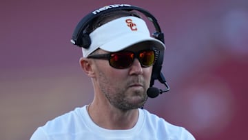Oct 21, 2023; Los Angeles, California, USA; Southern California Trojans head coach Lincoln Riley watches from the sidelines against the Utah Utes in the first half at United Airlines Field at Los Angeles Memorial Coliseum. Mandatory Credit: Kirby Lee-Imagn Images