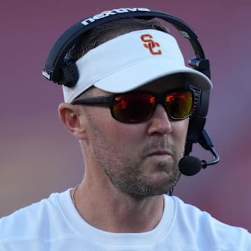 Oct 21, 2023; Los Angeles, California, USA; Southern California Trojans head coach Lincoln Riley watches from the sidelines against the Utah Utes in the first half at United Airlines Field at Los Angeles Memorial Coliseum. Mandatory Credit: Kirby Lee-Imagn Images