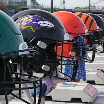 Oct 7, 2023; London, United Kingdom; Large oversized helmets of the New York Jets Baltimore Ravens, Cleveland Browns and Cincinnati Bengals at the NFL Experience London at the Battersea Power Station. Mandatory Credit: Kirby Lee-Imagn Images