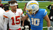 Sep 29, 2024; Inglewood, California, USA; Kansas City Chiefs quarterback Patrick Mahomes (15) and Los Angeles Chargers quarterback Justin Herbert (10) shake hands after the game at SoFi Stadium. Mandatory Credit: Kirby Lee-Imagn Images