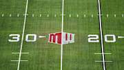 The Mountain West conference logo on the field at Allegiant Stadium. 