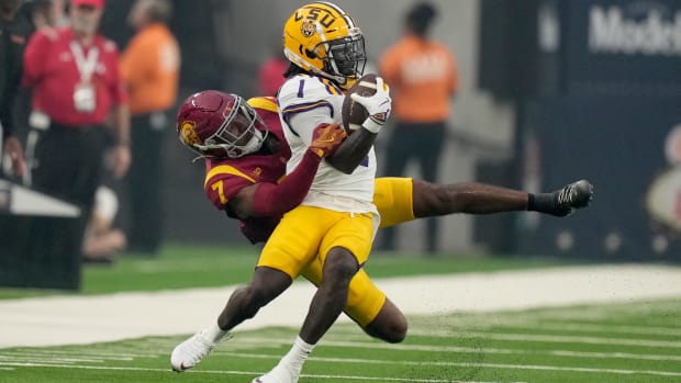 Sep 1, 2024; Paradise, Nevada, USA; LSU Tigers wide receiver Aaron Anderson (1) is tackled by Southern California Trojans saf