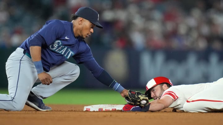 Los Angeles Angels first baseman Nolan Schanuel (right) slides into second base against Seattle Mariners second baseman Jorge Polanco (left) for a stolen base. 