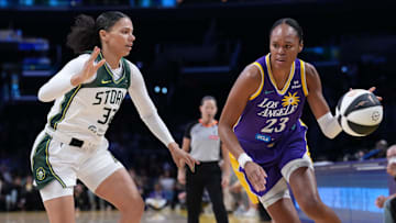Jun 17, 2025; Los Angeles, California, USA; LA Sparks forward Azura Stevens (23) is defended by Seattle Storm forward Alysha Clark (32) in the first half at Crypto.com Arena. Mandatory Credit: Kirby Lee-Imagn Images