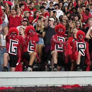 Sep 23, 2023; Athens, Georgia, USA; Georgia Bulldogs fans spell out \"Georgia\" on their chests during the game against the UAB Blazers at Sanford Stadium. Mandatory Credit: Kirby Lee-Imagn Images