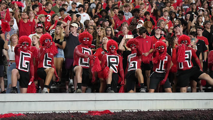 Sep 23, 2023; Athens, Georgia, USA; Georgia Bulldogs fans spell out \"Georgia\" on their chests during the game against the UAB Blazers at Sanford Stadium. Mandatory Credit: Kirby Lee-Imagn Images