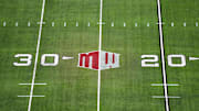 The Mountain West conference logo on the field at Allegiant Stadium. 