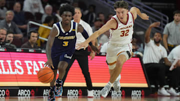 Nov 4, 2024; Los Angeles, California, USA; Chattanooga Mocs guard Honor Huff (3) dribbles the ball against Southern California Trojans guard Clark Slajchert (32) in the second half at Galen Center. Mandatory Credit: Kirby Lee-Imagn Images