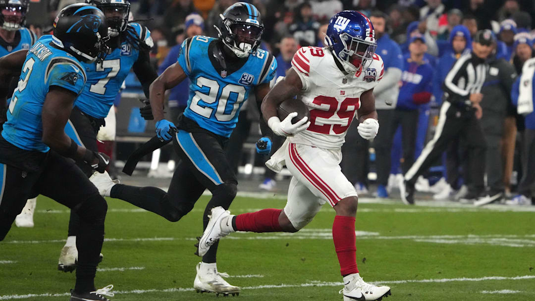 Nov 10, 2024; Munich, Germany; New York Giants running back Tyrone Tracy Jr. (29) carries the ball on a 32-yard touchdown run against the New York Giants in the second half during the 2024 NFL Munich Game at Allianz Arena.  