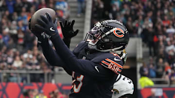Oct 13, 2024; London, United Kingdom; Chicago Bears wide receiver Keenan Allen (13) catches a three-yard touchdown pass against Jacksonville Jaguars cornerback Montaric Brown (30) in the second half during an NFL International Series game at Tottenham Hotspur Stadium. Mandatory Credit: Kirby Lee-Imagn Images