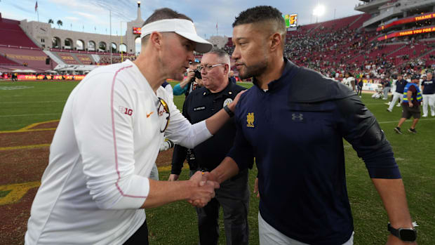 Nov 30, 2024; Los Angeles, California, USA; Southern California Trojans head coach Lincoln Riley and Notre Dame Fighting Iris