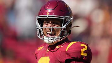 Sep 28, 2024; Los Angeles, California, USA; Southern California Trojans wide receiver Duce Robinson (2) celebrates after scoring on an 8-yard touchdown reception against the Wisconsin Badgersin the second half at United Airlines Field at Los Angeles Memorial Coliseum. Mandatory Credit: Kirby Lee-Imagn Images