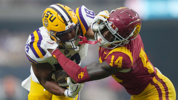 Sep 1, 2024; Paradise, Nevada, USA; LSU Tigers running back Josh Williams (18) carries the ball against Southern California T