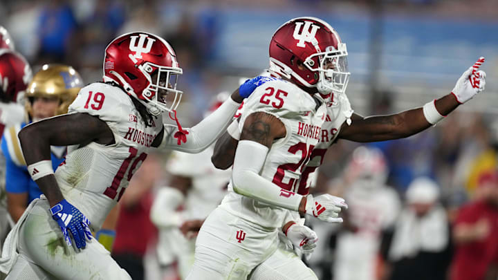 Indiana Hoosiers defensive backs Amare Ferrell (25) and Josh Sanguinetti (19) celebrate an interception against UCLA at the Rose owl.