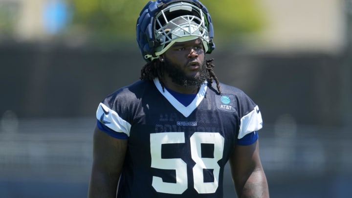 Jul 29, 2023; Oxnard, CA, USA; Dallas Cowboys defensive tackle Mazi Smith (58) wears a Guardian helmet cap during training camp at the River Ridge Fields. Mandatory Credit: Kirby Lee-USA TODAY Sports