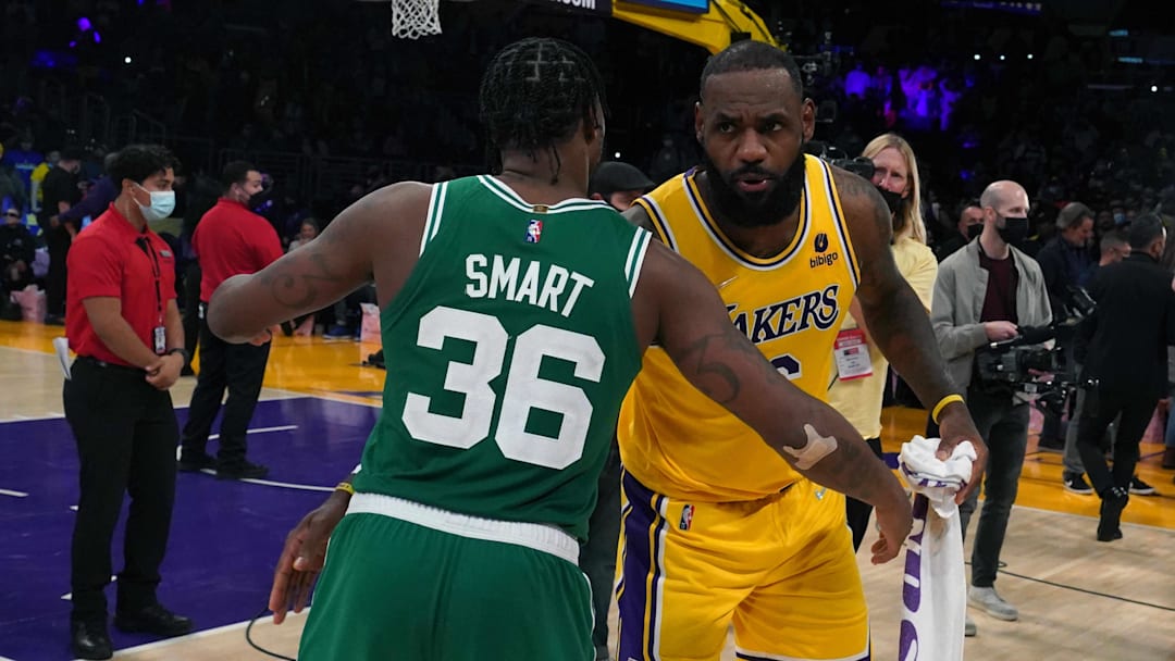 Dec 7, 2021; Los Angeles, California, USA; Boston Celtics guard Marcus Smart (36) and Los Angeles Lakers forward LeBron James (6) embrace after the game at Staples Center.The Lakers defeated the Celtics 117-102.  Mandatory Credit: Kirby Lee-Imagn Images