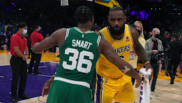 Dec 7, 2021; Los Angeles, California, USA; Boston Celtics guard Marcus Smart (36) and Los Angeles Lakers forward LeBron James (6) embrace after the game at Staples Center.The Lakers defeated the Celtics 117-102.  Mandatory Credit: Kirby Lee-Imagn Images