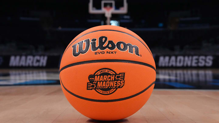 The March Madness logo is shown on a basketball. The March Madness logo is shown on a basketball.