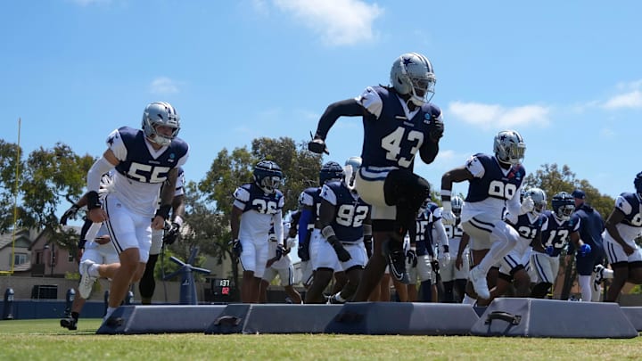 Dallas Cowboys defensive players run drills at training camp at the River Ridge Fields. Dallas Cowboys defensive players run drills at training camp at the River Ridge Fields.