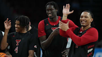 Mar 19, 2025; Wichita, KS, USA; Texas Tech Red Raiders guard Christian Anderson (4), forward Federiko Federiko (33) and forward Darrion Williams (5) react during practice at Intrust Bank Arena. Mandatory Credit: Kirby Lee-Imagn Images