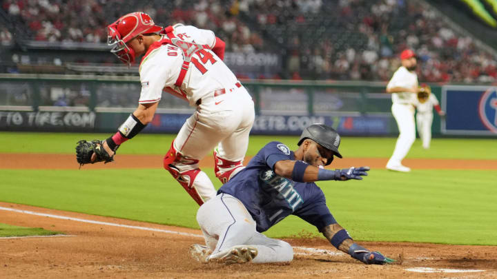 Seattle Mariners right fielder Victor Robles slides safe at home during a game against the Los Angeles Angels on Saturday at Angel Stadium.