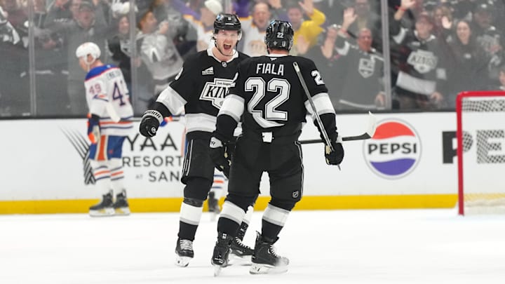 Apr 21, 2025; Los Angeles, California, USA; LA Kings left wing Kevin Fiala (22) celebrates with right wing Adrian Kempe (9) after scoring a goal in the third period of game one of the first round of the 2025 Stanley Cup Playoffs against the Edmonton Oilers at Crypto.com Arena. Mandatory Credit: Kirby Lee-Imagn Images