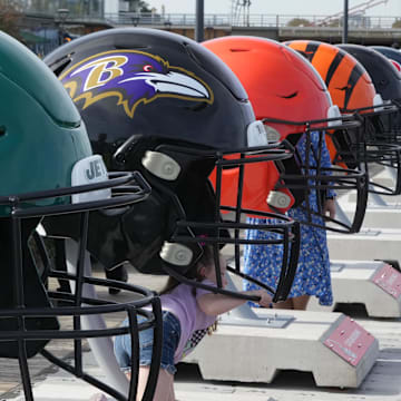 Oct 7, 2023; London, United Kingdom; Large oversized helmets of the New York Jets Baltimore Ravens, Cleveland Browns and Cincinnati Bengals at the NFL Experience London at the Battersea Power Station. Mandatory Credit: Kirby Lee-Imagn Images