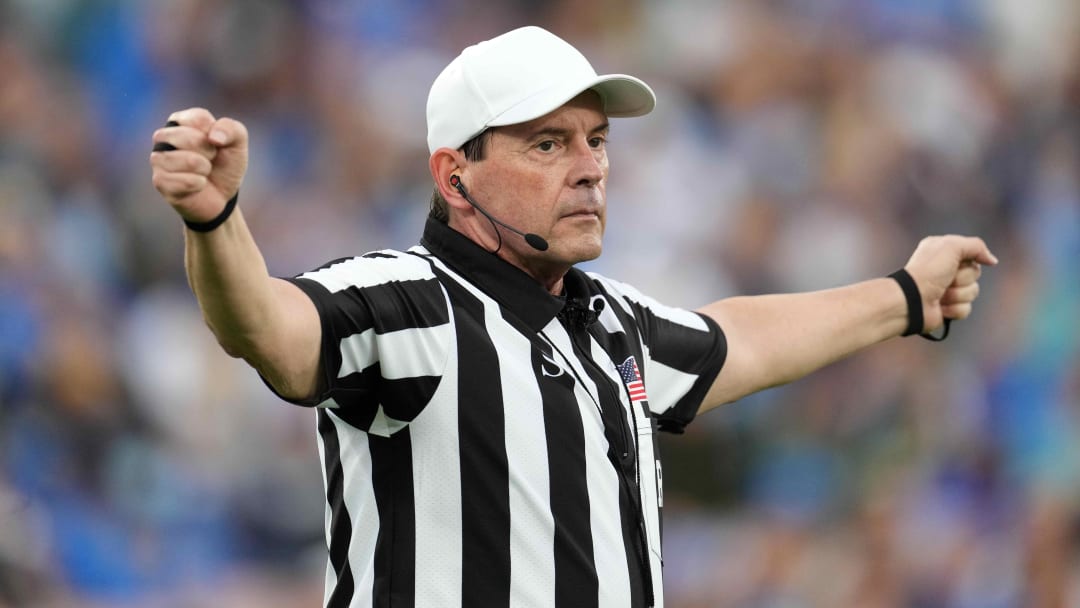 Oct 23, 2021; Pasadena, California, USA; NCAA referee Mark Duddy gesturesin the second half of the game between the UCLA Bruins and the Oregon Ducks at Rose Bowl. Oregon defeated UCLA 34-31.  Mandatory Credit: Kirby Lee-USA TODAY Sports
