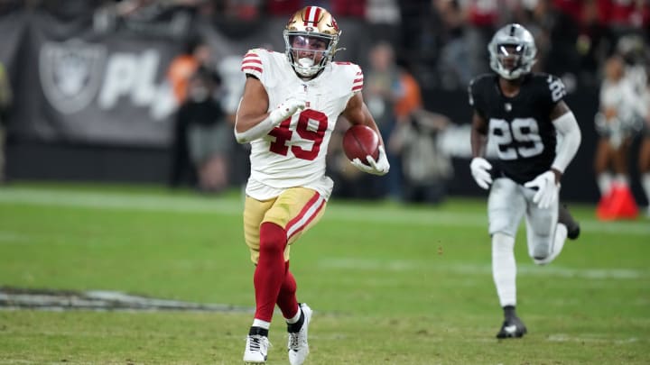 Aug 23, 2024; Paradise, Nevada, USA;  San Francisco 49ers running back Isaac Guerendo (49) carries the ball on a kickoff return against the Las Vegas Raiders in the first half at Allegiant Stadium. Mandatory Credit: Kirby Lee-USA TODAY Sports