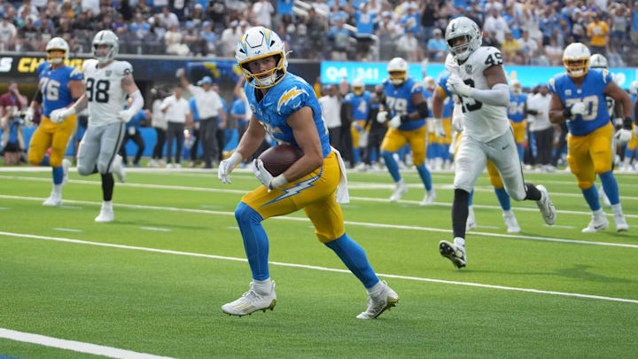 Sep 8, 2024; Inglewood, California, USA; Los Angeles Chargers wide receiver Ladd McConkey (15) scores on a 15-yard touchdown reception against the Los Angeles Chargers in the second half at SoFi Stadium. Mandatory Credit: Kirby Lee-Imagn Images